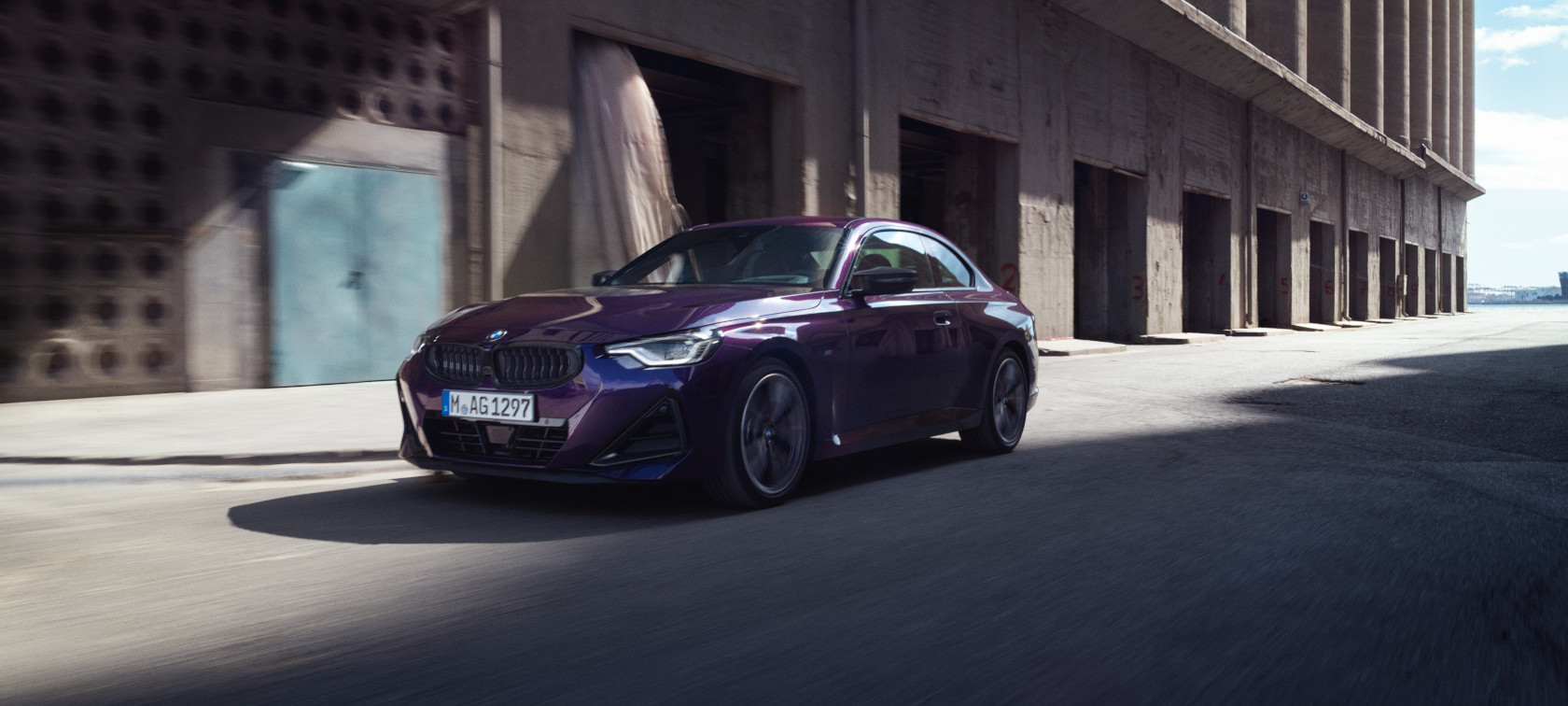 BMW 2 Series Coupé G42 2024 Thundernight metallic three-quarter front view driving 